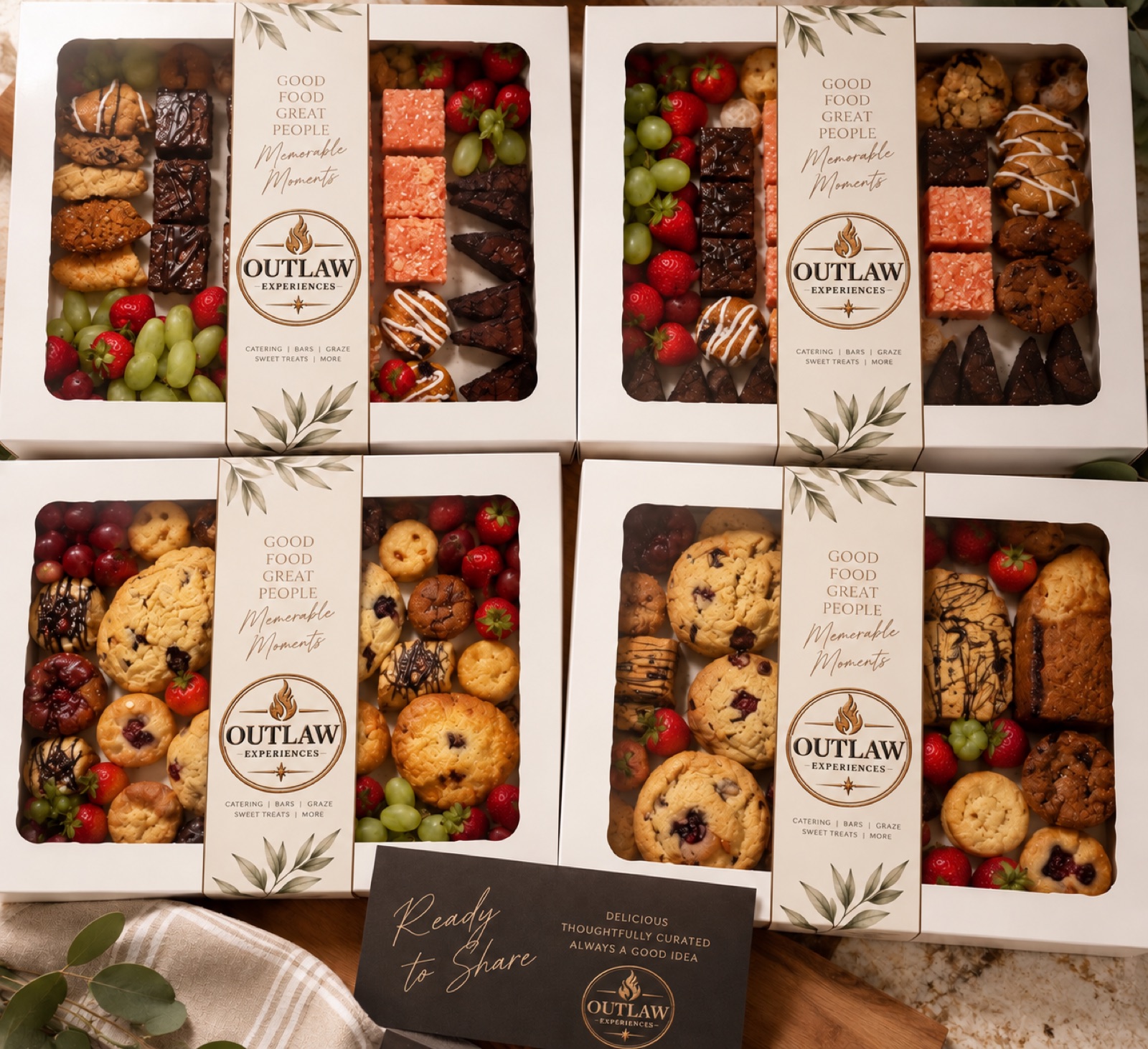 Outlaw Experiences corporate catering boxes — ready to share